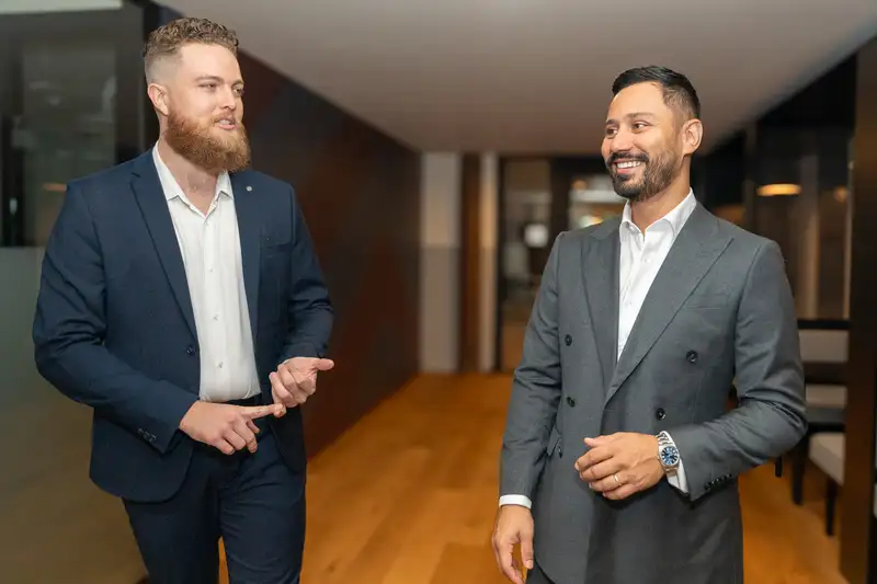 Tank Insurance brokers discussing debt collector professional indemnity requirements