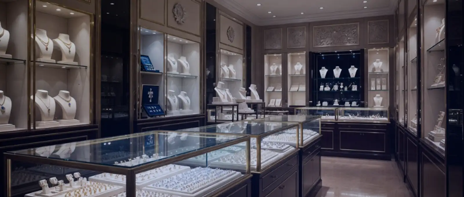 High-end jewellery showroom with illuminated display cabinets and valuable stock requiring specialist retail insurance
