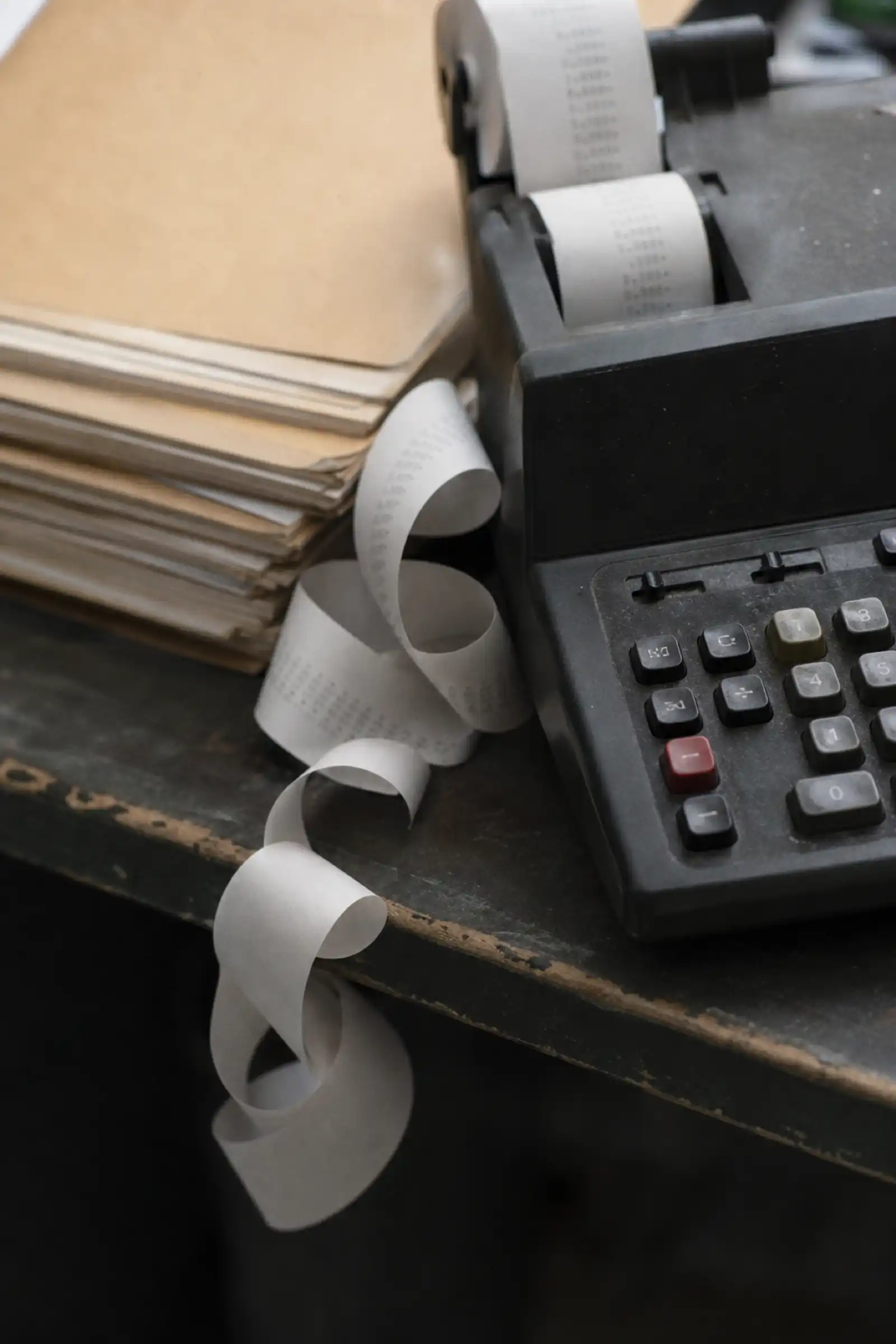 Adding machine tape on a bookkeeper's desk, bookkeeper professional indemnity insurance cost