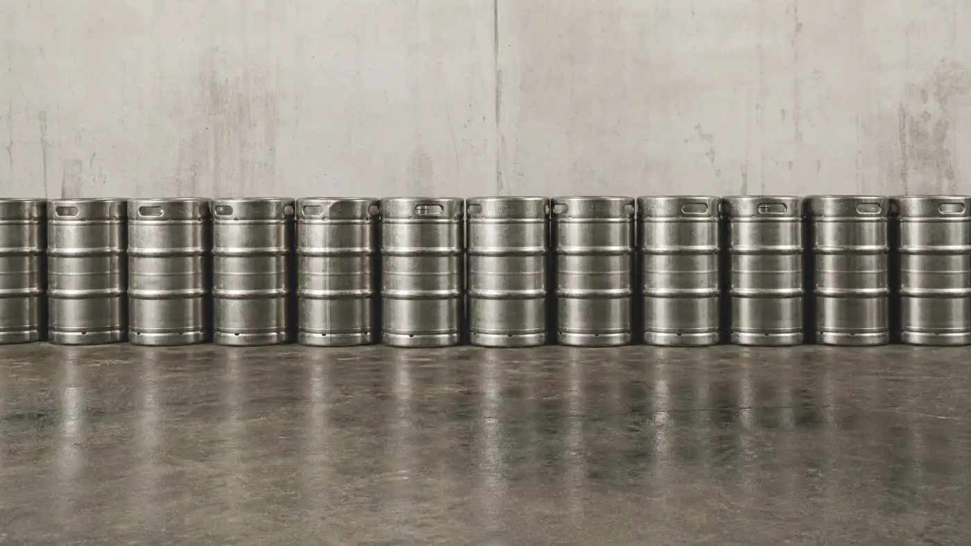Row of stainless beer kegs for brewery stock and equipment insurance