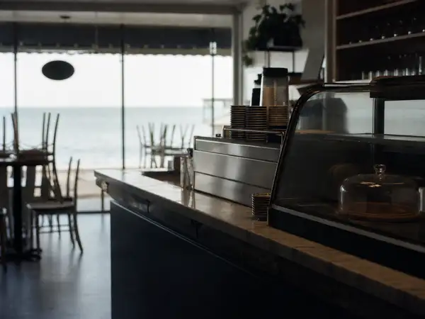 Coastal cafe counter before opening, the small businesses Central Coast insurance brokers protect