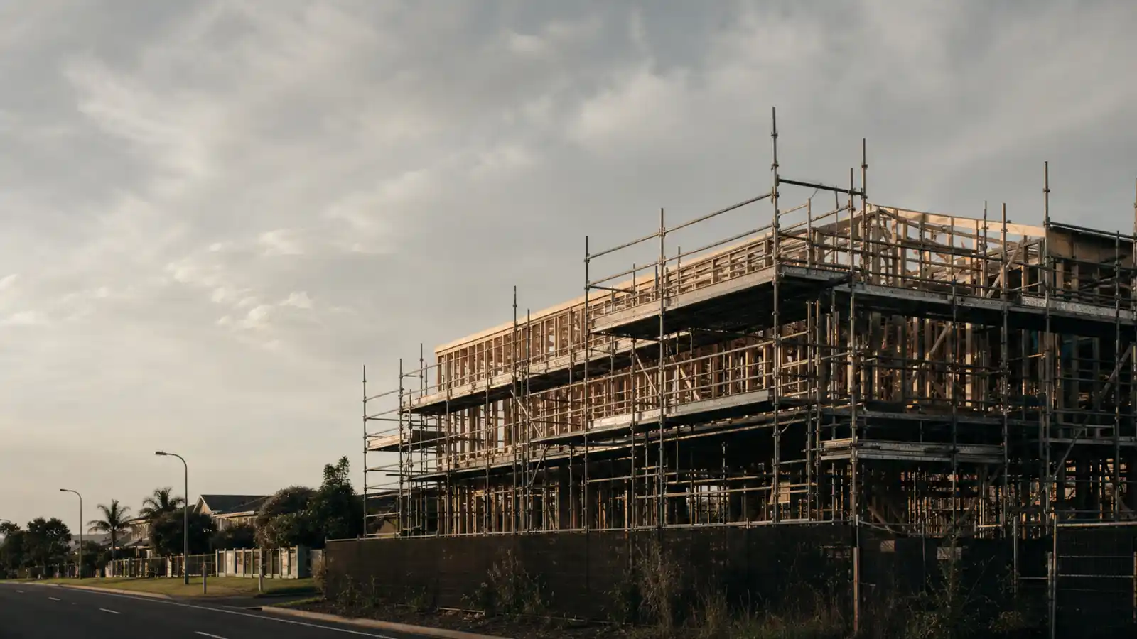 Building frame under scaffolding awaiting inspection, professional indemnity insurance for certifiers