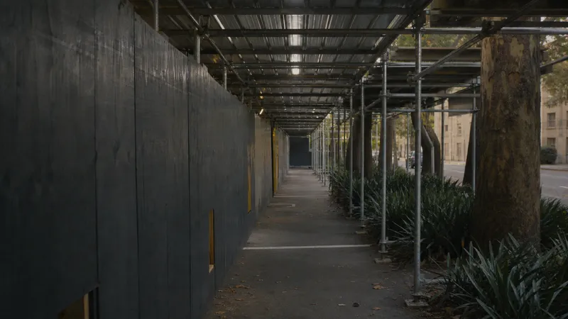 Pedestrian walkway hoarding under site scaffolding - contract works and public liability insurance
