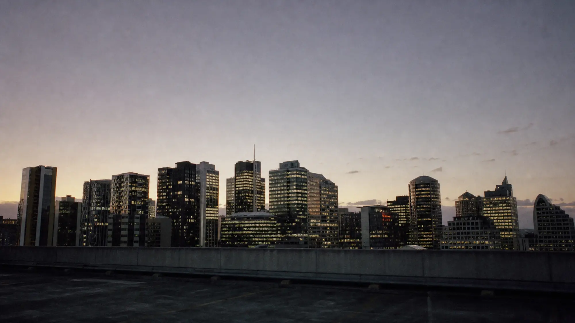 City office towers at dusk, home to company boards protected by directors and officers insurance