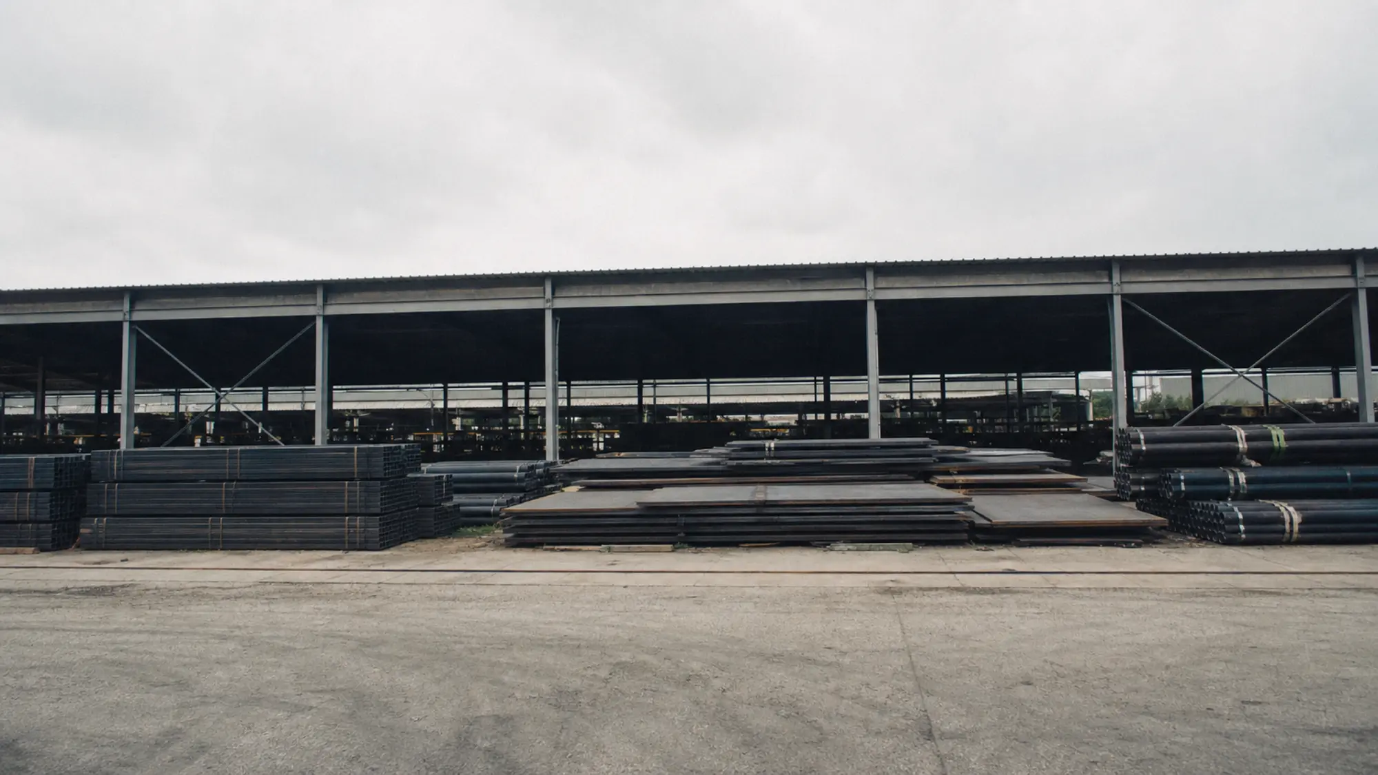 Racked steel sections in a stockyard - insurance for materials engineering consultants