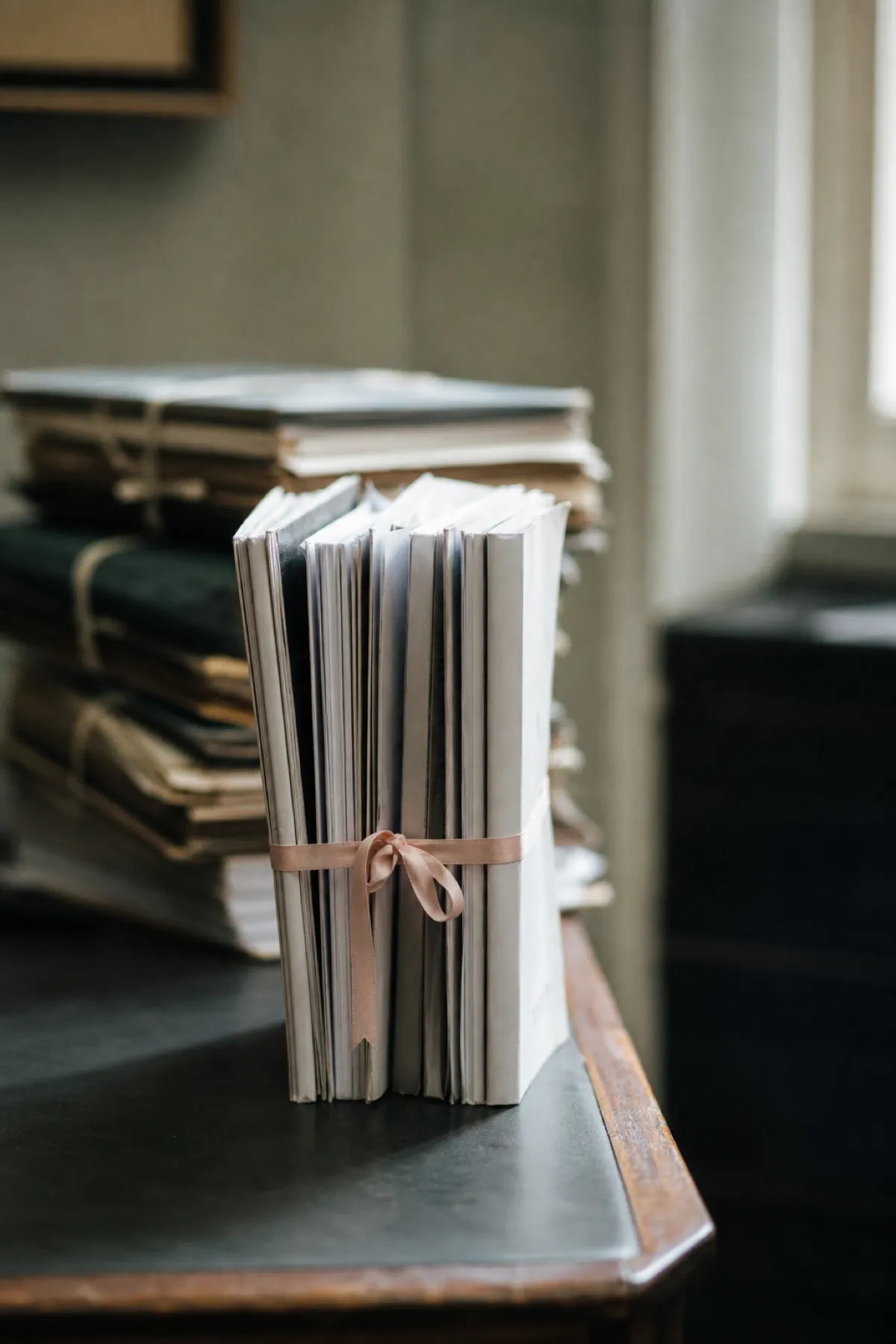 Ribbon-tied legal brief bundle representing legal consultant PI coverage