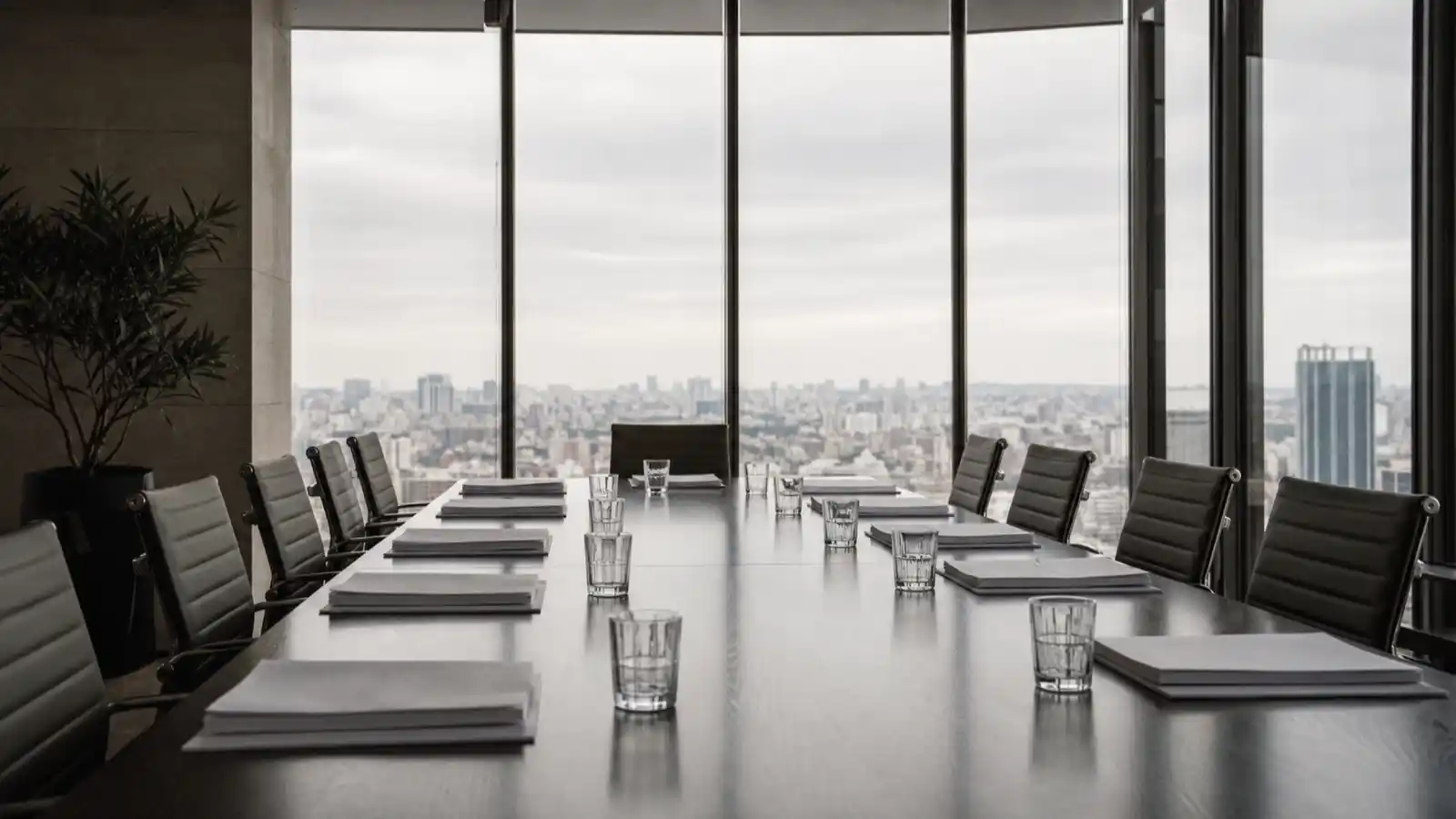 Boardroom table set for a transaction completion, the work M&A advisor PI insurance covers