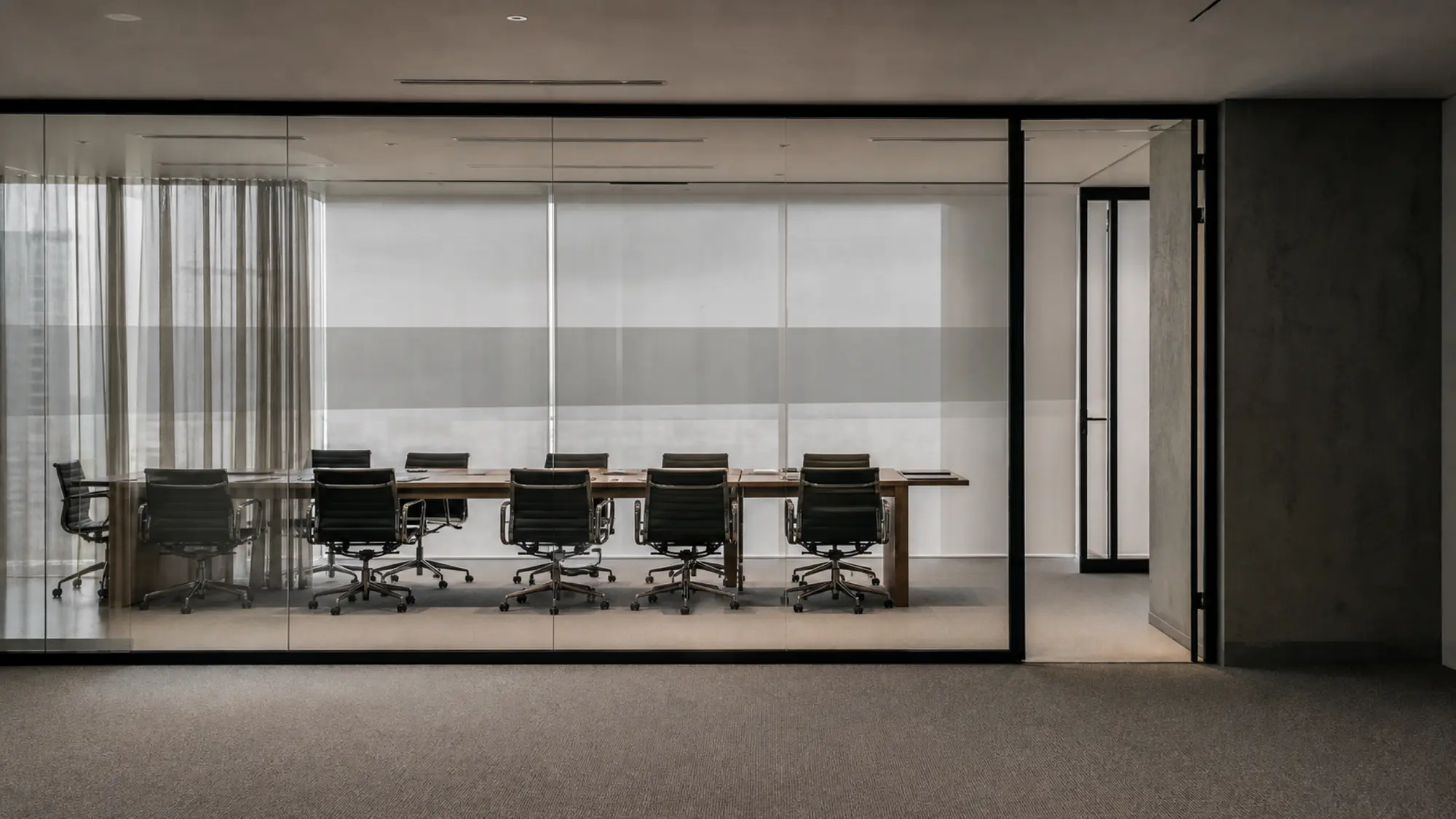 Office meeting room through a glass wall - management liability insurance cost quote