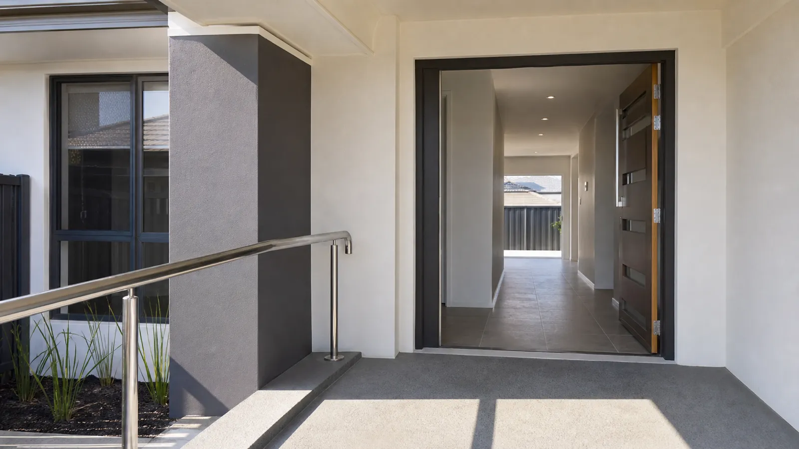 Level-entry accessible home with a wide doorway and handrail for NDIS and SDA accommodation