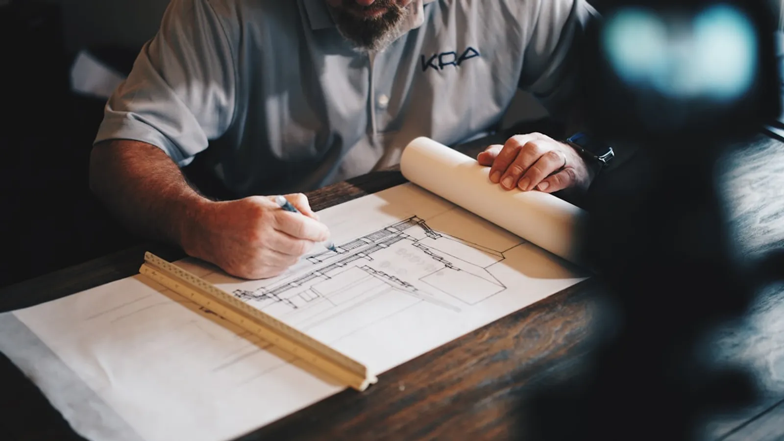 Professional reviewing building plans for acoustic compliance