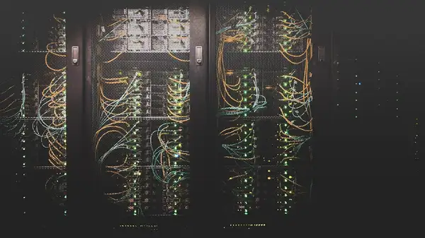 Data centre server room with rows of equipment and cooling systems