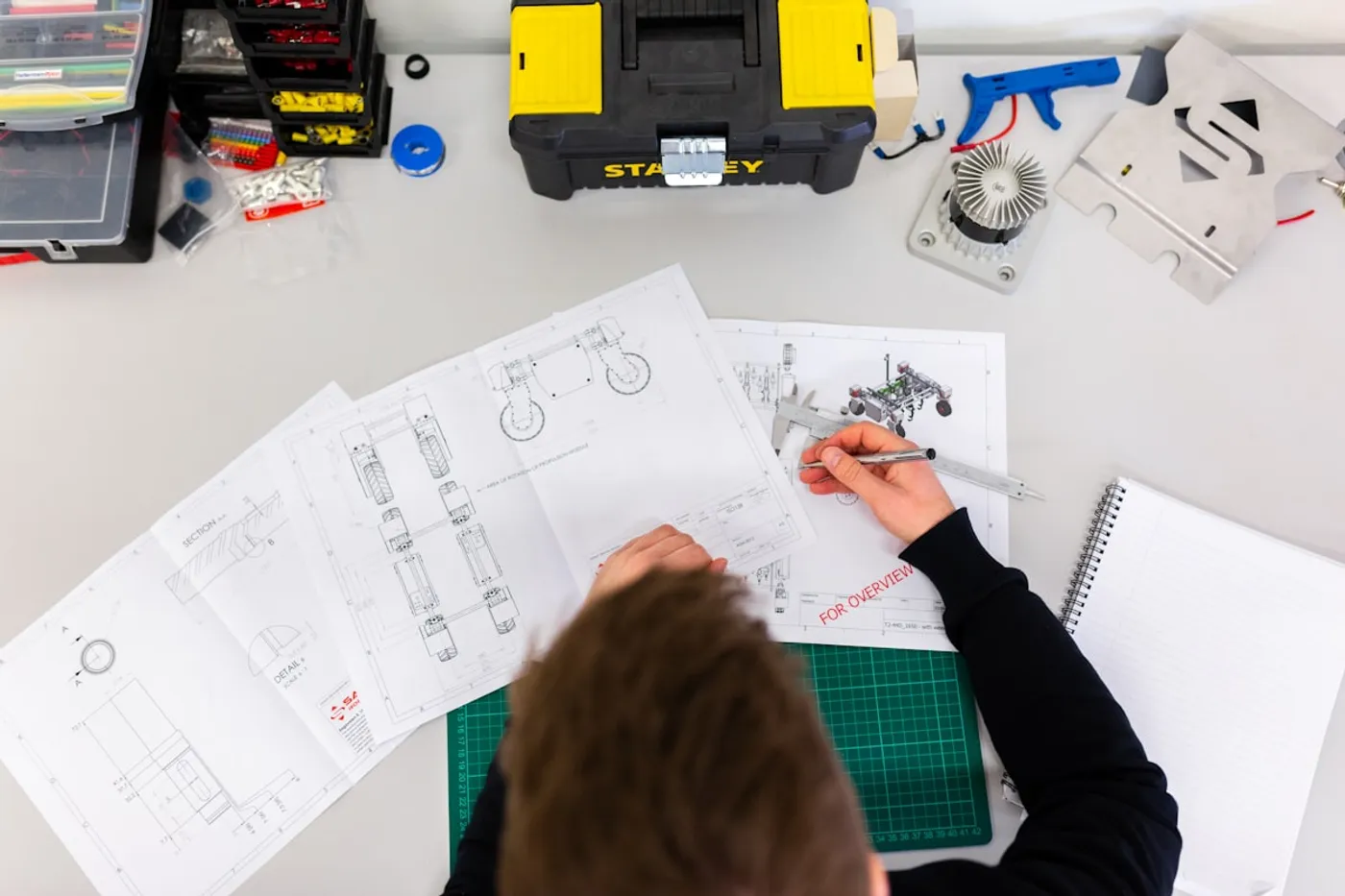Product design engineer at workstation representing PI coverage