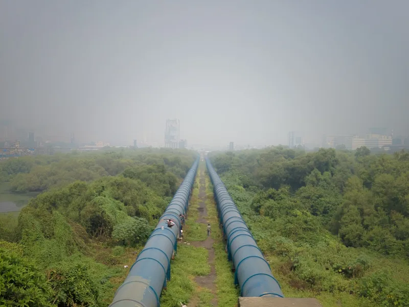Twin water supply pipelines running through landscape representing water infrastructure engineering