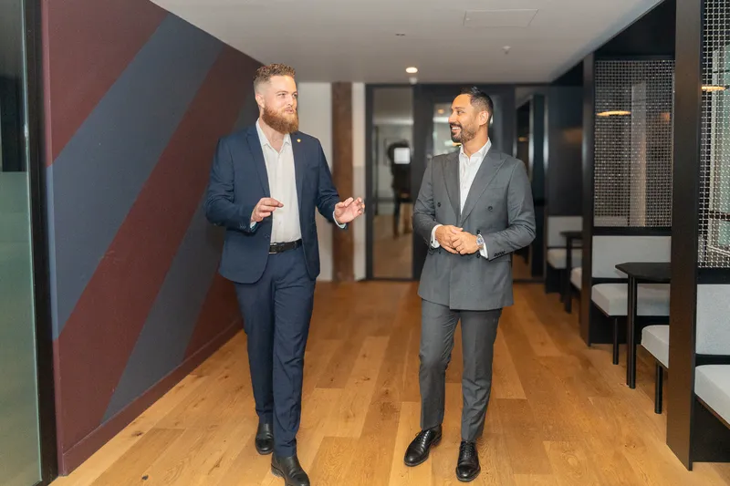 Client consulting with a specialist professional indemnity insurance broker in a modern office