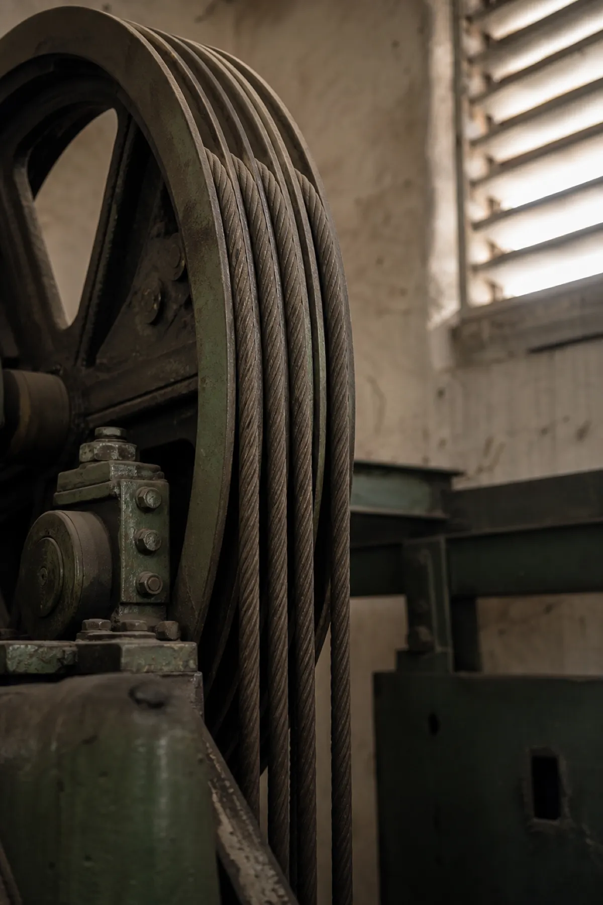 Lift sheave and hoist ropes in a strata motor room, plant covered by machinery breakdown insurance