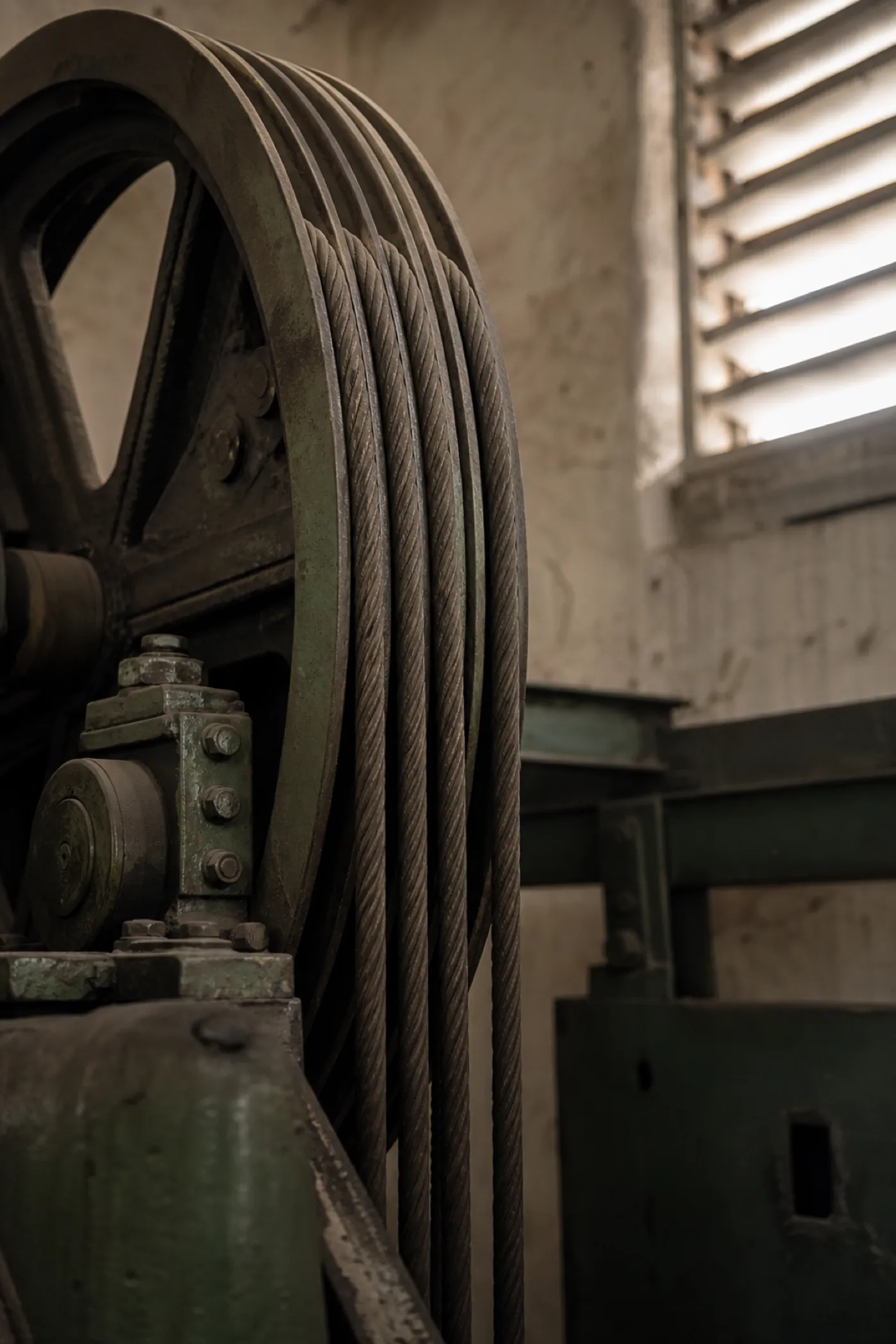 Lift sheave and hoist ropes in a strata motor room, plant covered by machinery breakdown insurance