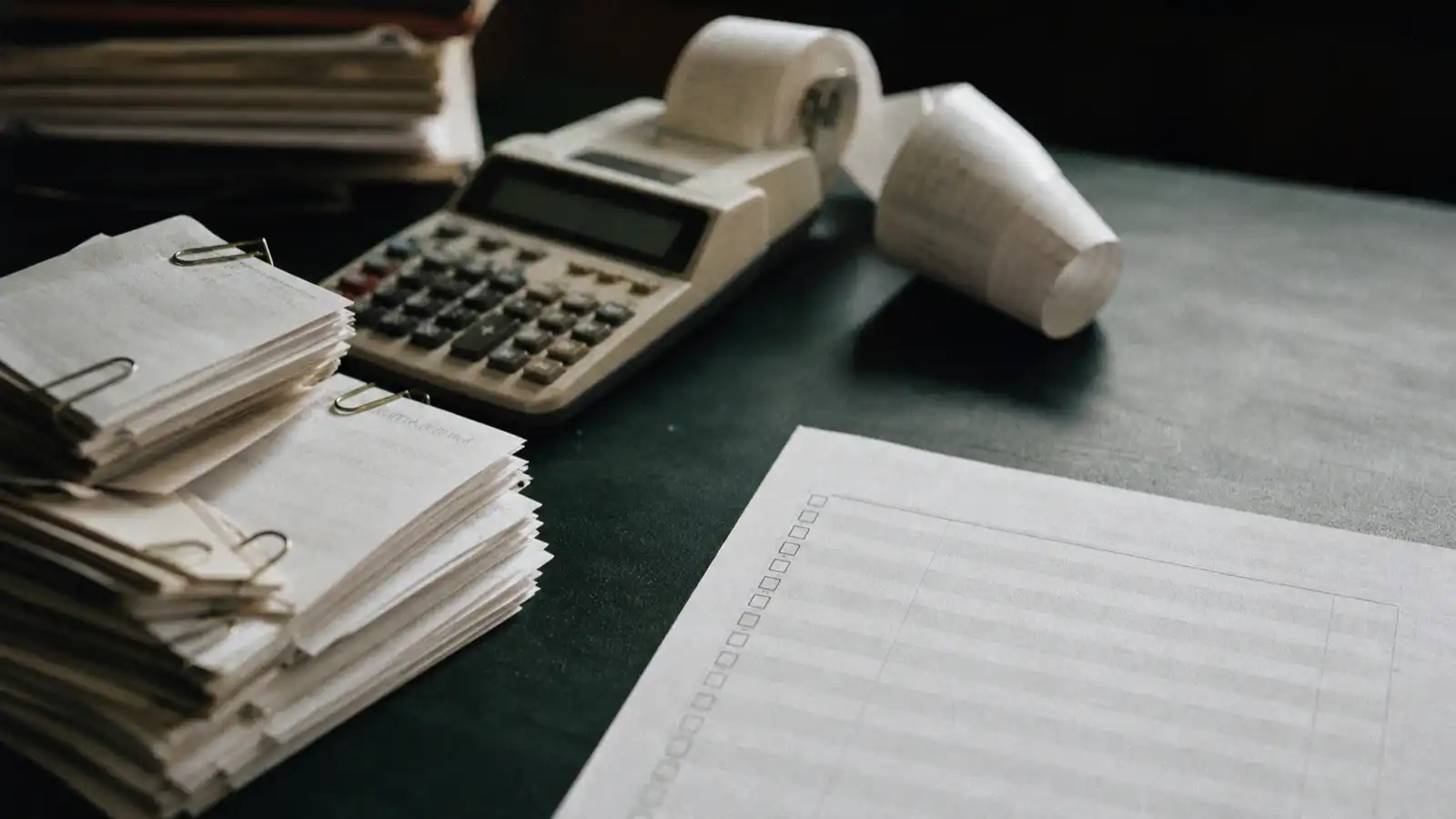 Receipts and a lodgement checklist on a BAS agent's desk, TPB minimum professional indemnity cover